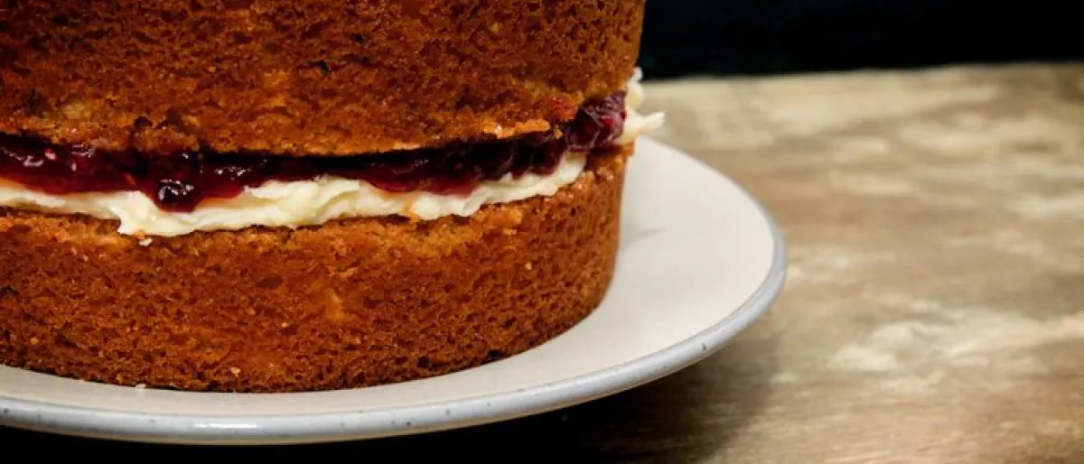 A classic, uncut Victoria sponge with a deep filling of butter cream and jam